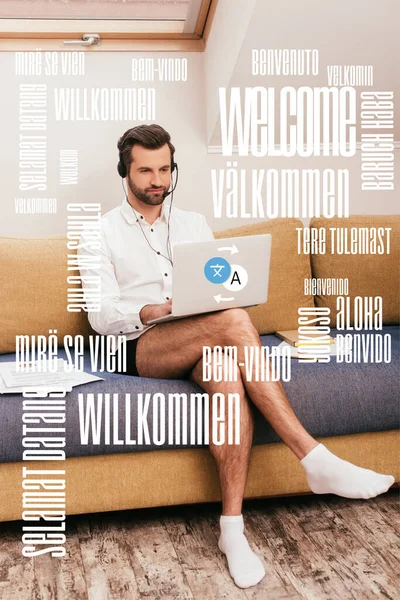 Bonito Homem Camisa Calcinha Usando Laptop Fone Ouvido Sofá Casa — Fotografia de Stock