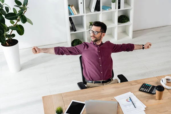 High Angle View Young Businessman Stretching Hands While Sitting Workplace — Stock Photo, Image