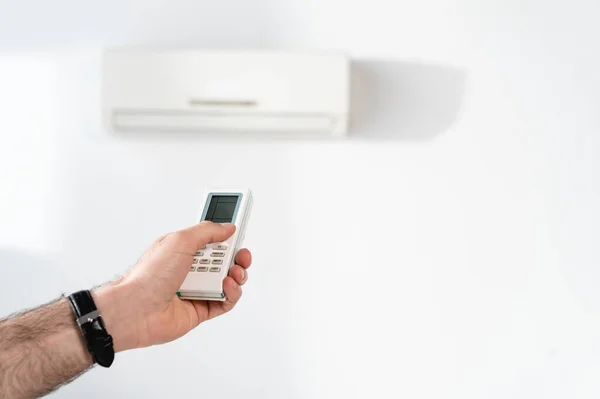 Cropped View Businessman Switching Air Conditioner Remote Controller — Stock Photo, Image