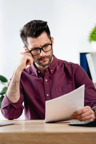 Serious Businessman Eyeglasses Reading Document While Sitting Workplace — Stock Photo, Image