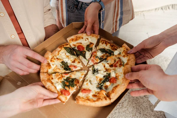 Cropped View Friends Holding Pieces Delicious Pizza Home — Stock Photo, Image