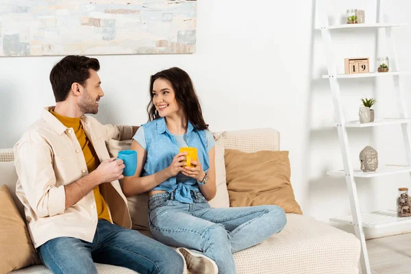 Beautiful Smiling Girl Looking Boyfriend While Holding Cup Coffee Couch — Stock Photo, Image