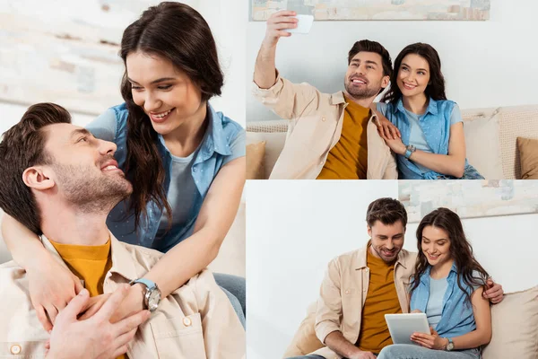 在沙发上拥抱和使用数码设备的一对笑容满面的情侣 — 图库照片