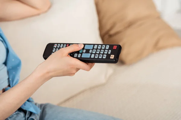 Cropped View Girl Holding Remote Controller Couch — Stock Photo, Image