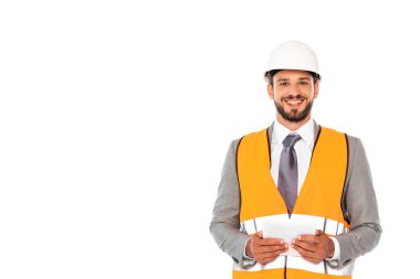 Smiling engineer in suit and hardhat holding digital tablet isolated on white clipart