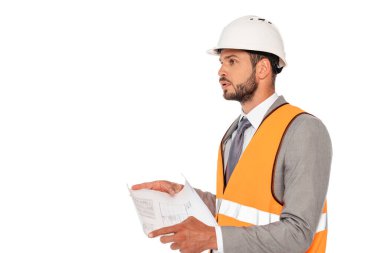 Handsome engineer in safety vest and hardhat holding blueprint isolated on white clipart