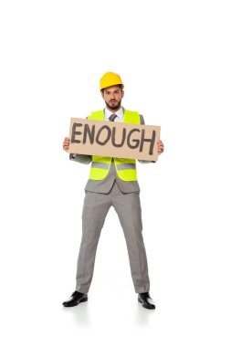 Engineer in suit and hardhat holding signboard with enough lettering and looking at camera on white background clipart