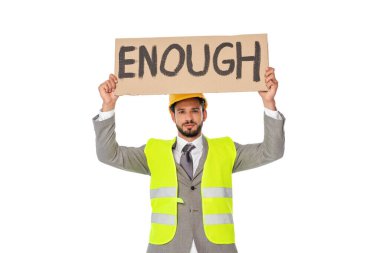 Engineer in suit and safety vest holding signboard with enough lettering isolated on white clipart