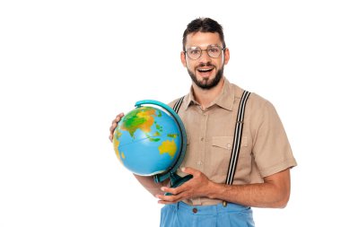 Cheerful nerd in eyeglasses and suspenders holding globe isolated on white clipart