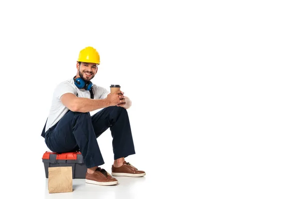 Smiling Repairman Uniform Holding Coffee While Sitting Toolbox Paper Bag — Stock Photo, Image