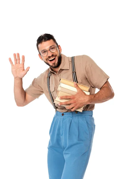 Nerd Positivo Sosteniendo Libros Agitando Mano Cámara Aislado Blanco — Foto de Stock