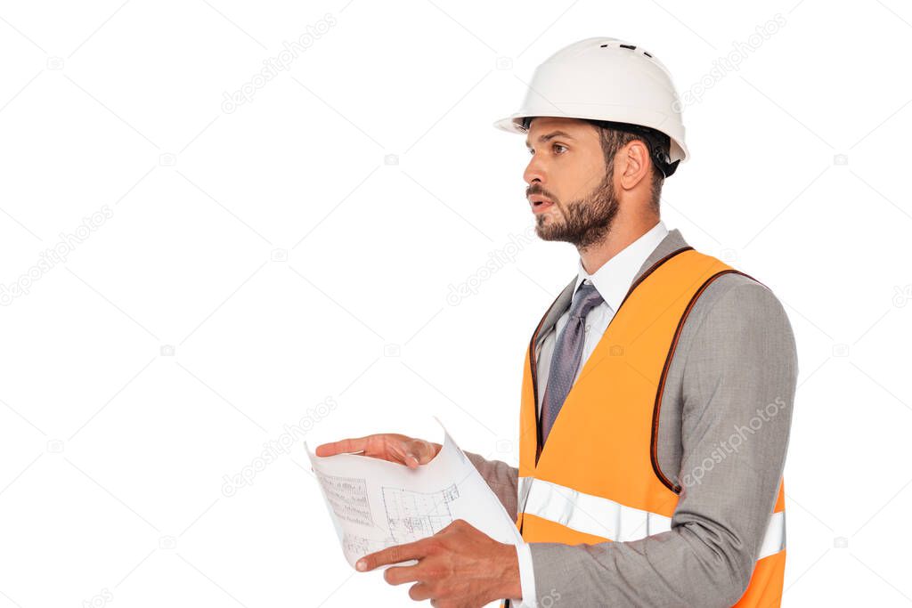 Handsome engineer in safety vest and hardhat holding blueprint isolated on white