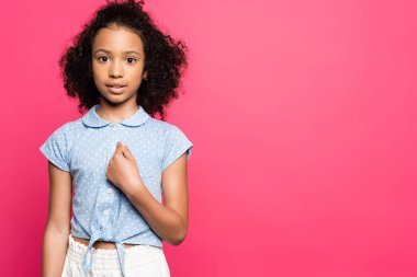 cute curly african american kid pointing with finger at herself isolated on pink clipart