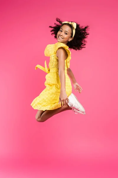 Side View Happy Curly African American Child Yellow Outfit Jumping — Stock Photo, Image