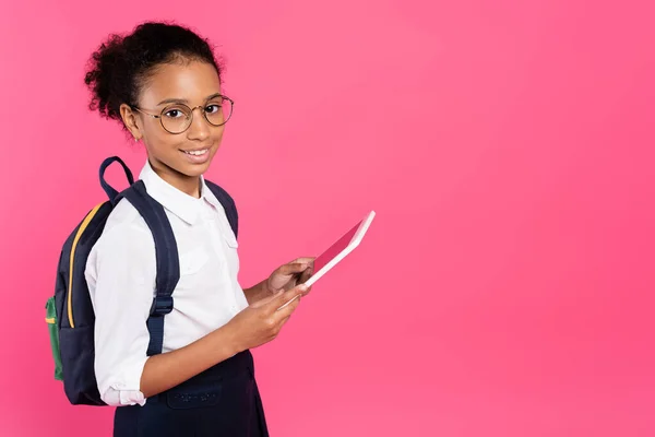 Smiling African American Schoolgirl Glasses Backpack Using Digital Tablet Isolated — Stock Photo, Image