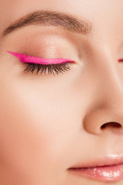 close up view of beautiful woman with pink eyeliner clipart