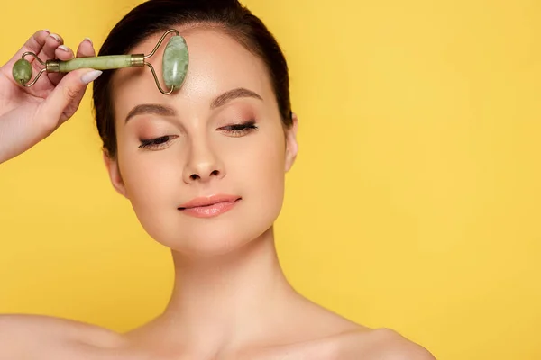 Beautiful Naked Woman Using Jade Roller Face Isolated Yellow — Stock Photo, Image