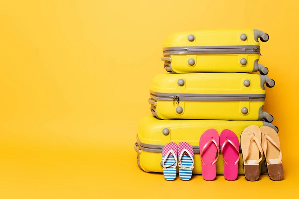 Travel Bags Family Flip Flops Isolated Yellow — Stock Photo, Image