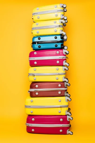 Colorful Travel Bags Stack Isolated Yellow — Stock Photo, Image