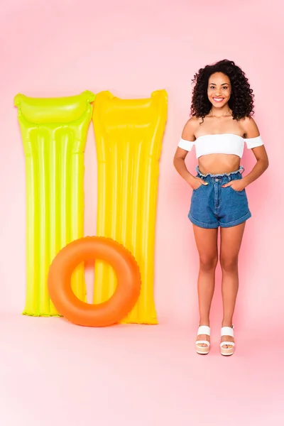 Cheerful African American Girl Standing Hands Pockets Swim Ring Inflatable — Stock Photo, Image