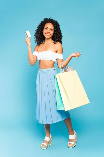 Happy African American Girl Holding Shopping Bags Credit Card Blue — Stock Photo, Image