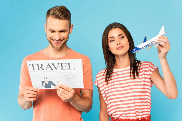 Happy Woman Holding Toy Plane Bearded Man Reading Travel Newspaper — Stock Photo, Image