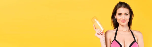 Horizontal Concept Happy Girl Swimsuit Holding Bottle Sunblock Isolated Yellow — Stock Photo, Image