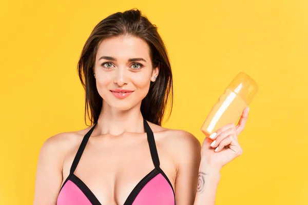 Cheerful Girl Swimsuit Holding Bottle Sunblock Isolated Yellow — Stock Photo, Image