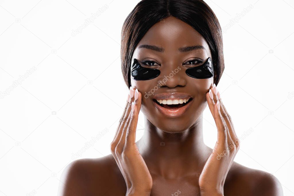 african american naked woman with hydrogel eye patches on face isolated on white