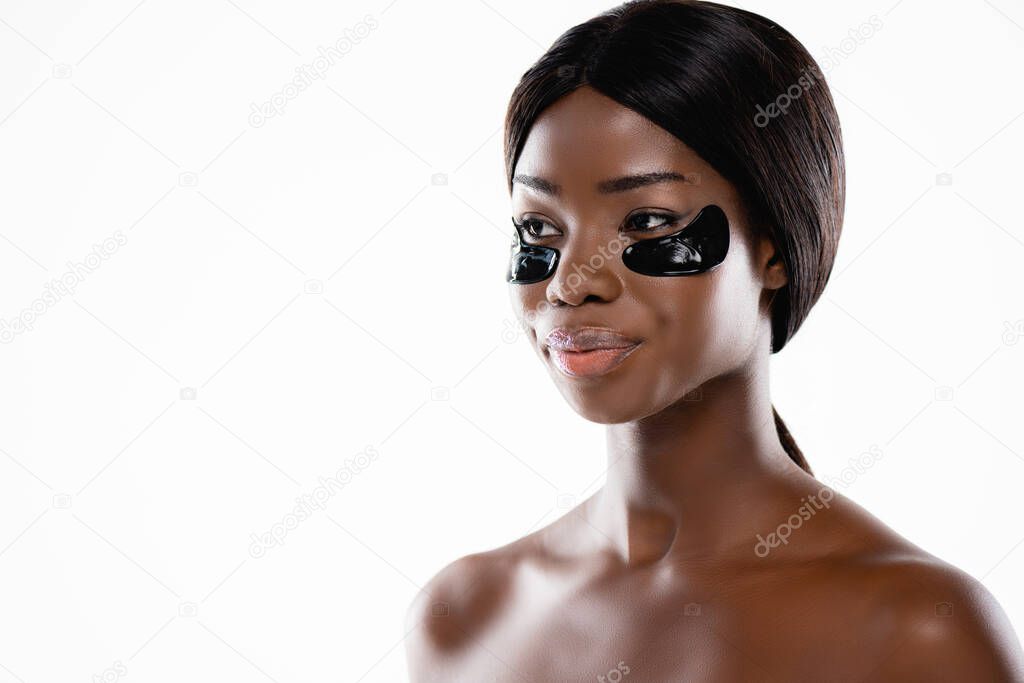 african american naked woman with hydrogel eye patches on face isolated on white