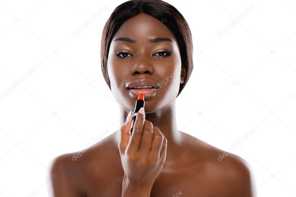 african american naked woman applying lipstick isolated on white