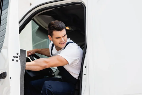 Pensive Loader Looking Away While Driving Truck Urban Street — Stock Photo, Image