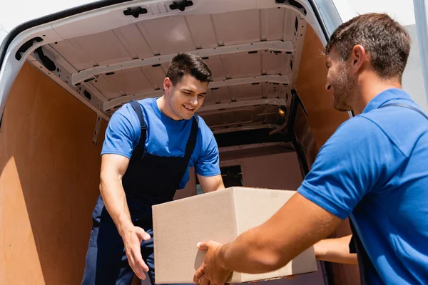 Movers Cardboard Box Unloading Truck Urban Street — Stock Photo, Image