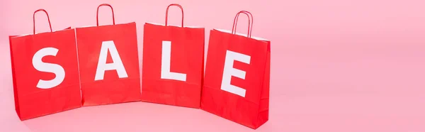 Horizontal Crop Word Sale Red Shopping Bags Pink Background — Stock Photo, Image