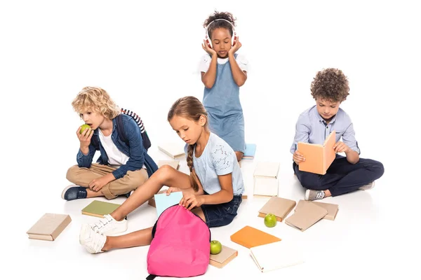 Schoolkids Sitting Books Apples African American Child Wireless Headphones Isolated — Stock Photo, Image