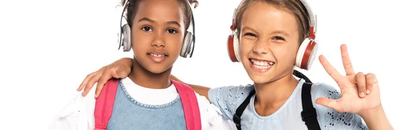 Panoramic Crop Schoolkid Listening Music Wireless Headphones Hugging African American — Stock Photo, Image