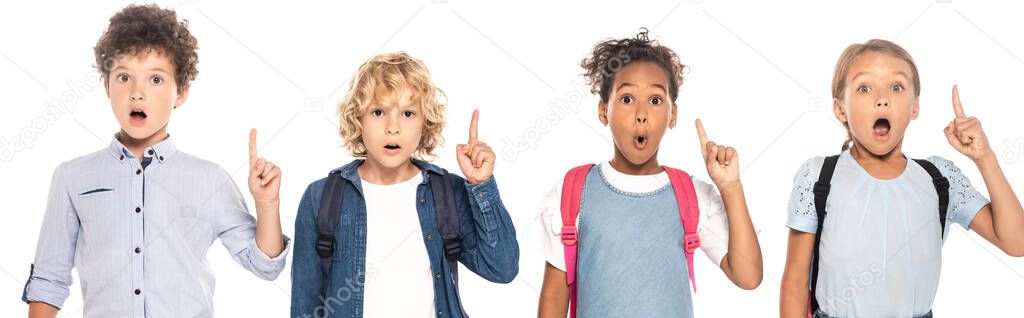 website header of shocked multicultural schoolgirls and schoolboys showing idea sign isolated on white 