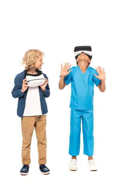 Curly Boy Looking Kid Virtual Reality Headset Gesturing Isolated White — Stock Photo, Image