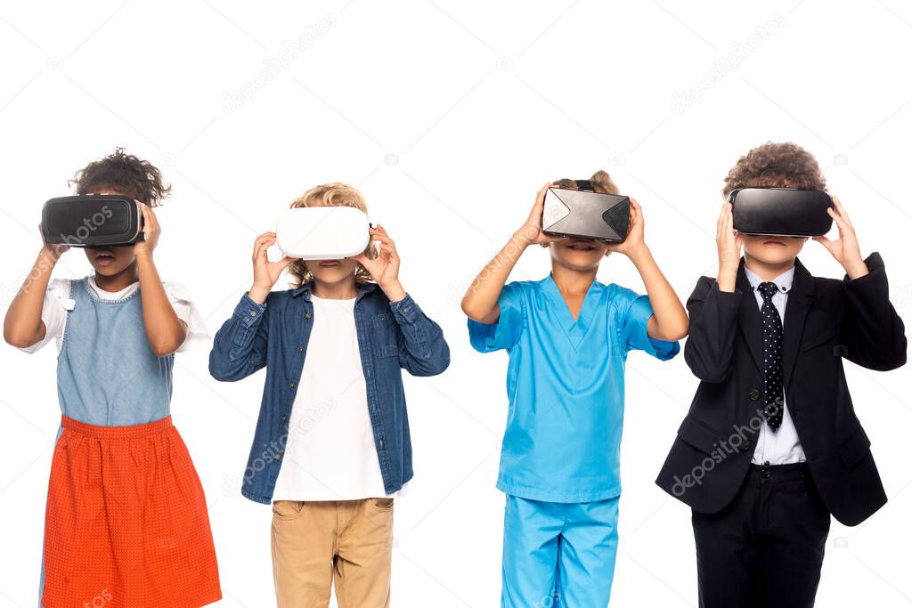 multicultural kids dressed in costumes of different professions touching virtual reality headsets isolated on white 
