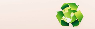 top view of green recycling symbol with planet isolated on beige, panoramic shot clipart
