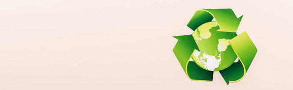 top view of green recycling symbol with planet isolated on beige, panoramic shot