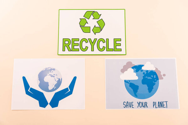 top view of ecological placards isolated on beige