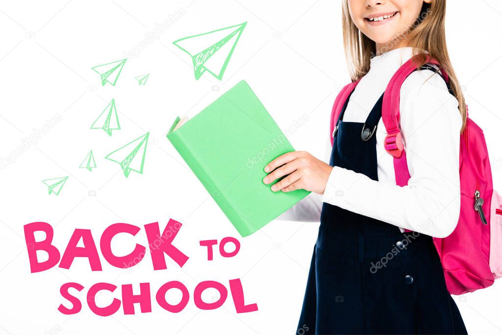 cropped view of schoolgirl holding book isolated on white, back to school illustration