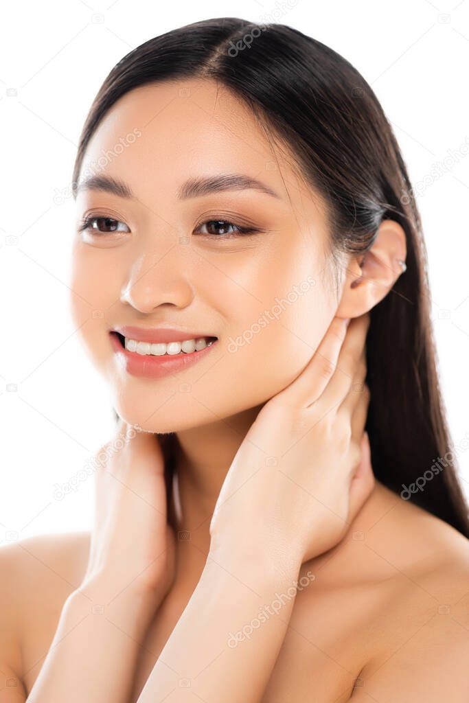 Portrait of young asian woman touching neck isolated on white