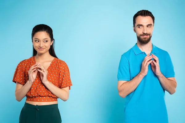 Sly Asian Woman Red Blouse Tricky Man Polo Shirt Gesturing — Stock Photo, Image