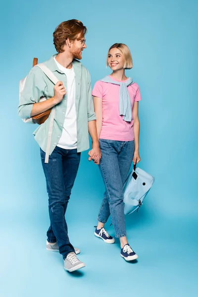 Young Students Holding Hands While Walking Blue — Stock Photo, Image