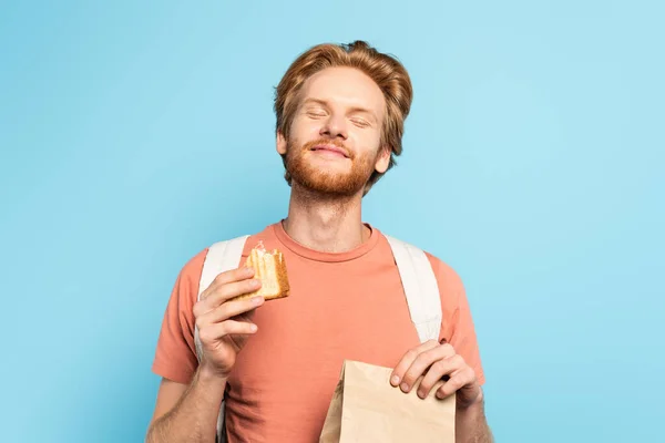 Young Redhead Student Closed Eyes Holding Paper Bag Toast Bread — Stock Photo, Image
