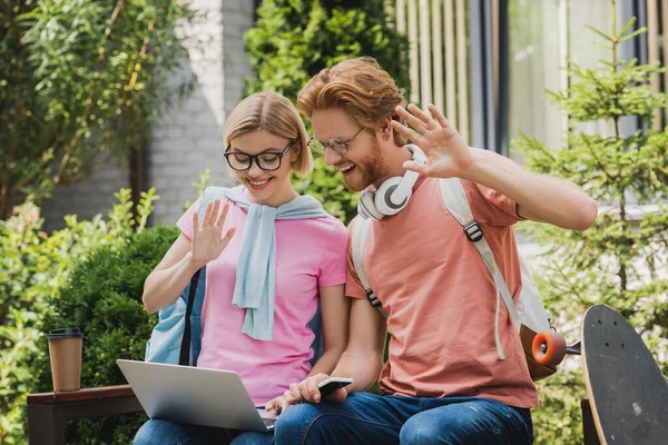 Students Glasses Looking Laptop While Waving Hands Sitting Bench — Stock Photo, Image