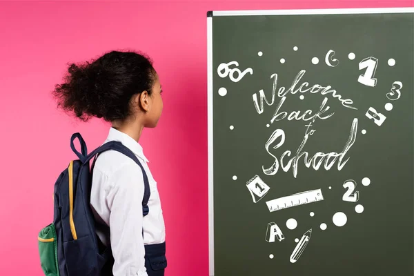 African American Schoolgirl Looking Chalkboard Welcome Back School Lettering Pink — Stock Photo, Image