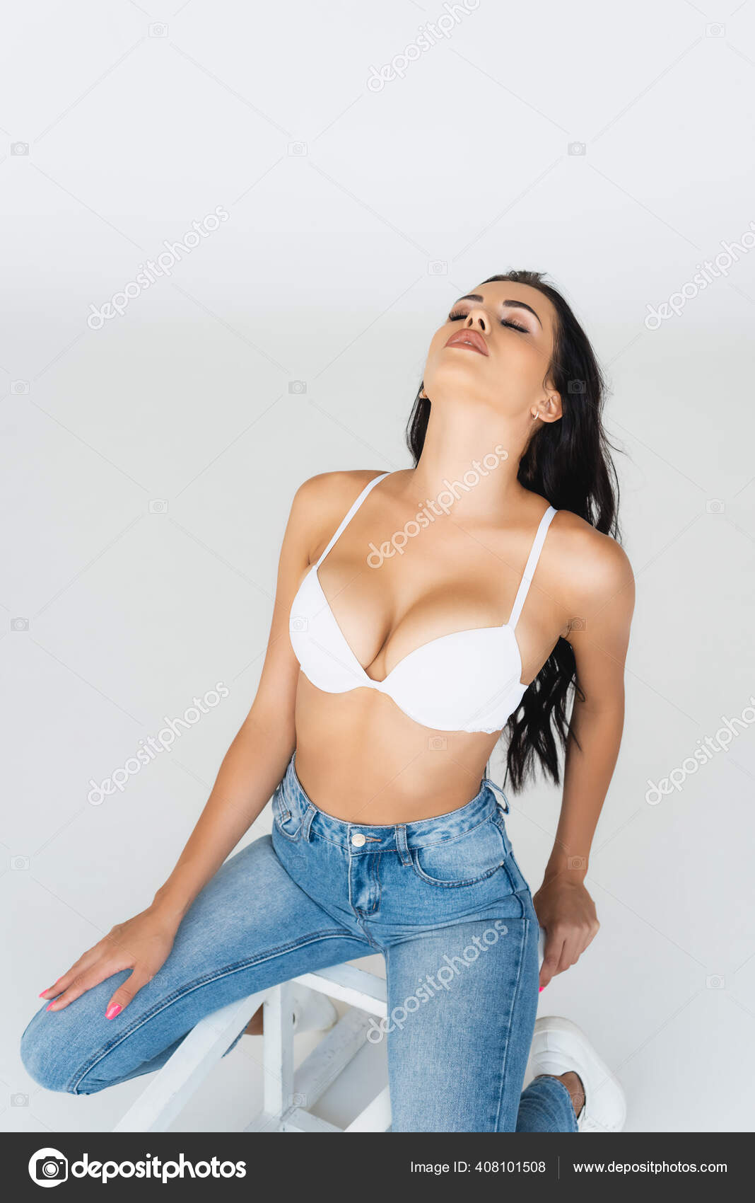 Sexy Woman Closed Eyes Jeans Bra Sitting Chair Isolated Grey